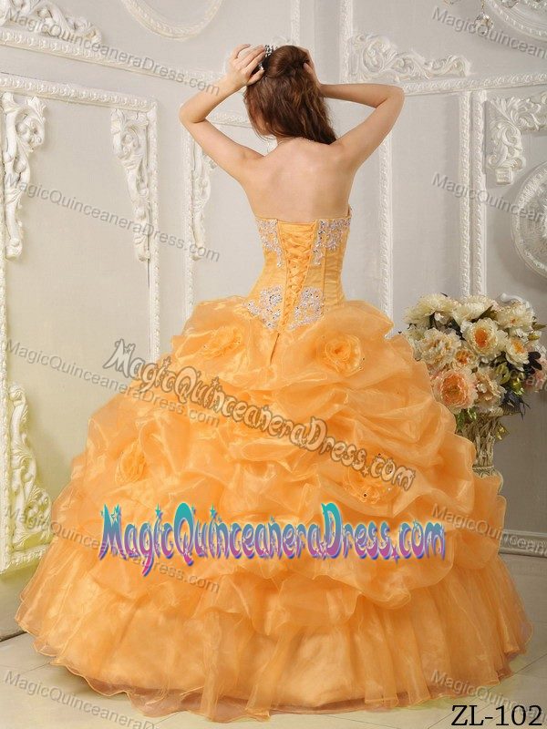 Strapless Orange Beaded Long Dress for Quinces with Pick-ups and Flower