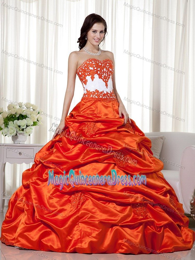 Zipper-up Orange Red Long Quinces Dresses with Appliques and Pick-ups