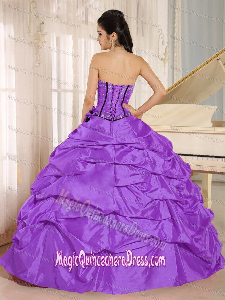 Sweetheart Purple Beaded Ruffled Quinceanera Dress with Handmade Flower in Aptos