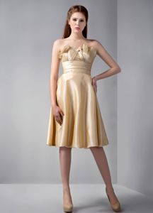 Unique Strapless Champagne Knee-length Damas Quinceanera Dress with Ruche