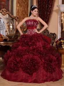 Burgundy Strapless Floor-length Quince Dresses with Rolling Flowers