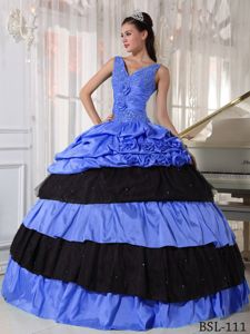 Blue and Black V-neck Long Quinceanera Gown with Pick-ups and Flowers